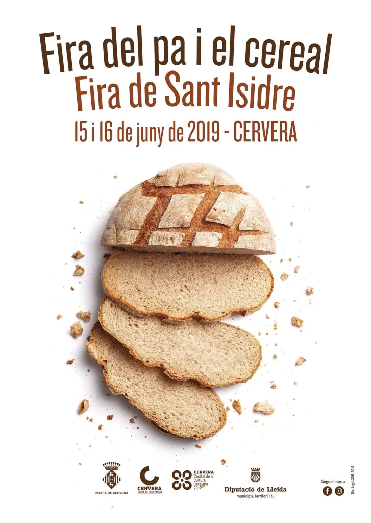 Cartell de la Fira del Pa i el Cereal i Fira de Sant Isidre, amb la fotografia d'una barra de pa rodona tallada a llesques i molles escampades, el 15 i 16 de juny de 2019